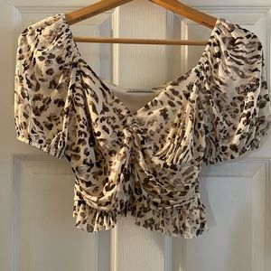 Urban Outfitters leopard print semi shear top. Cropped with small ruffle hem
